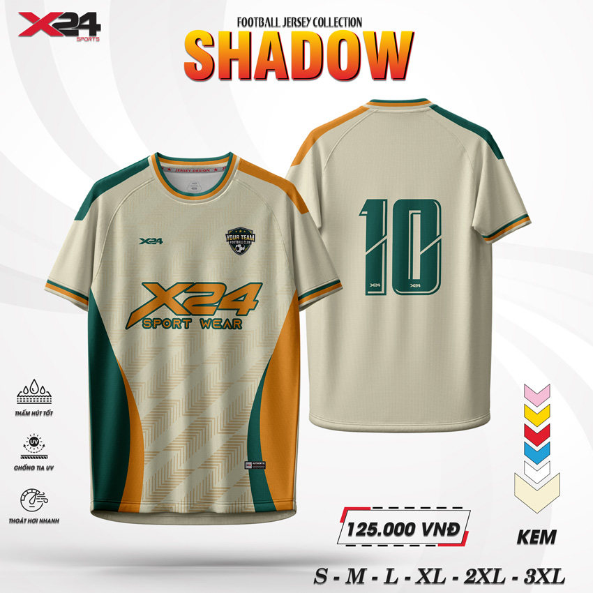 Áo bóng đá màu kem SHADOW X24 Sport Wear với họa tiết zig-zag, phối màu cam đất và xanh rừng